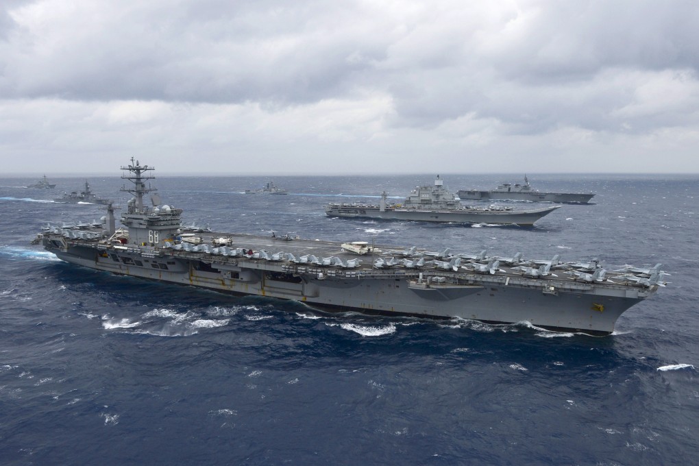 The aircraft carrier USS Nimitz leads a formation of ships in the Bay of Bengal as part of joint military exercises with India. Photo: AFP
