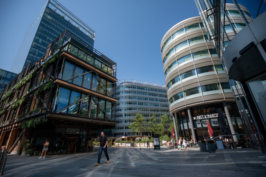 Pedestrians walk around the Hardman Street district of Manchester, UK. Photo: Bloomberg