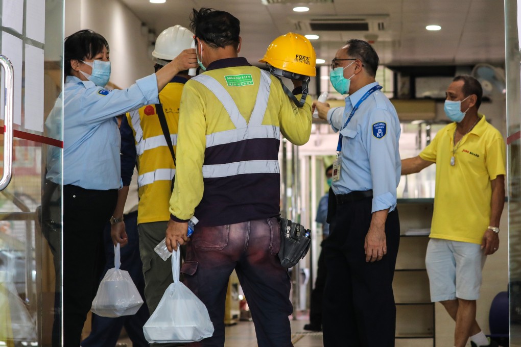 Workers bring takeaway lunch boxes to Henry G. Leong Yau Ma Tei Community Centre which was opened for people on Thursday. Photo: May Tse