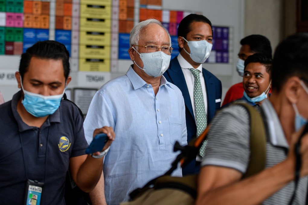 Former Malaysian Prime Minister Najib Razak (second from left), seen on July 29, was sentenced to 12 years in prison on Tuesday. Photo: Bernama via dpa
