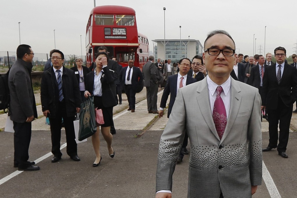 Developer Xu Weiping walks through derelict land at Royal Albert Dock in east London on May 29, 2013. File photo: Reuters