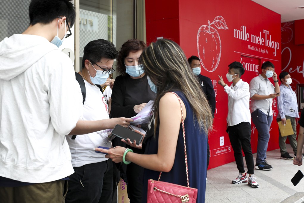 Potential buyers line up at the sales office of Henderson Land Development’s Seacoast Royale project in Tuen Mun on 1 August 2020 to bid for the first 185 flats at the project. Photo: Xiaomei Chen