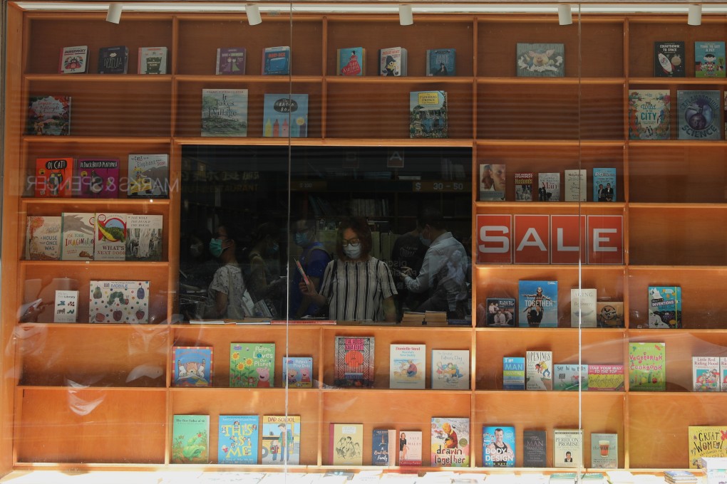 Book lovers grabbing bargains at Swindon Book Company Ltd, Hong Kong’s oldest bookshop, which is shutting its Lock Road outlet in Tsim Sha Tsui. Photo: SCMP / Nora Tam
