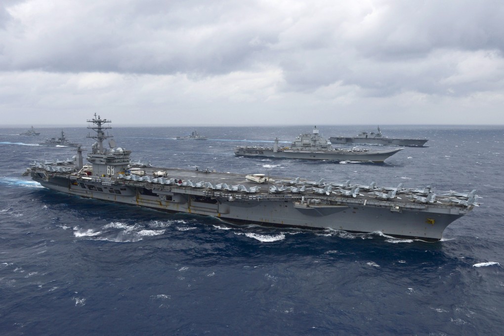 The aircraft carrier USS Nimitz leads a formation of ships from the Indian Navy, Japan Maritime Self-Defence Force and the US Navy in the Bay of Bengal during a naval exercise in 2017. Photo: AFP