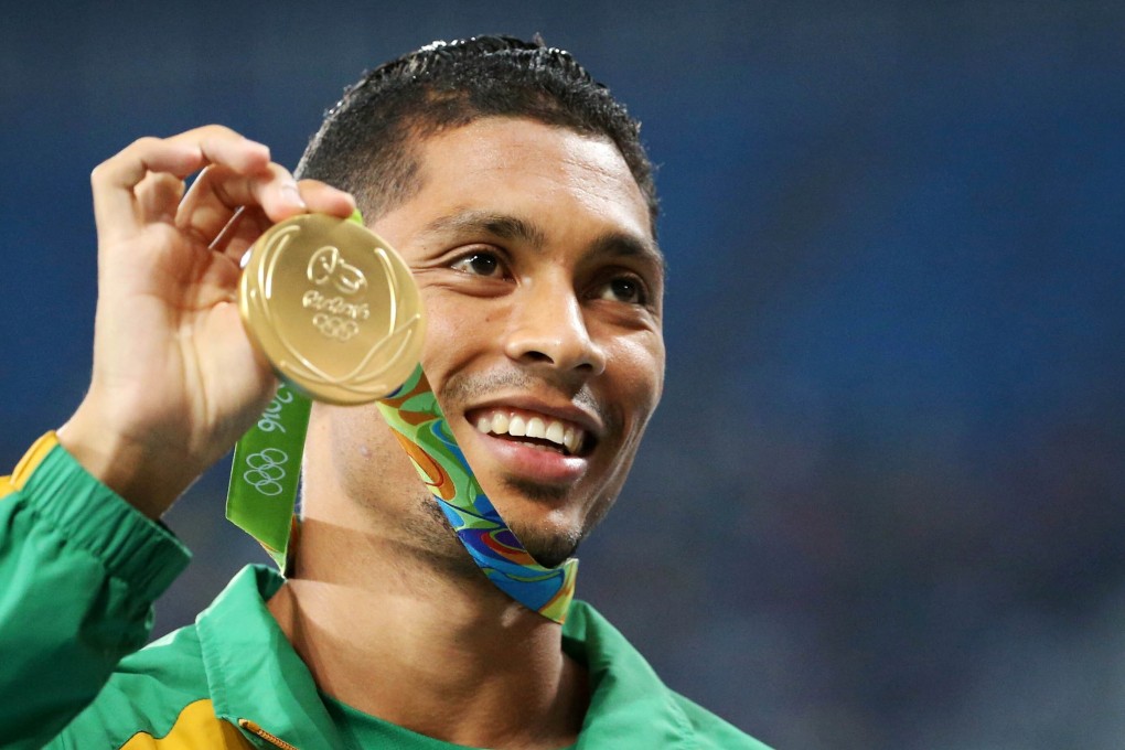 South Africa’s Wayde van Niekerk shows off his gold medal at the Rio Olympics. Photo: Reuters