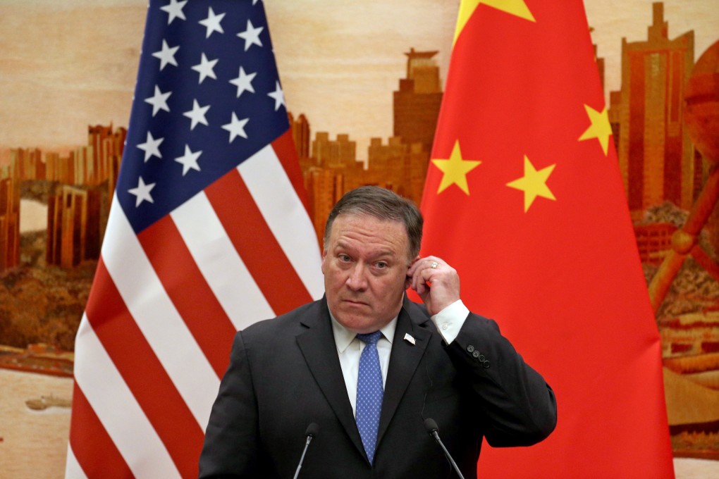 US Secretary of State Mike Pompeo adjusts his earpiece at a press conference in Beijing during a 2018 state visit. Photo: EPA-EFE