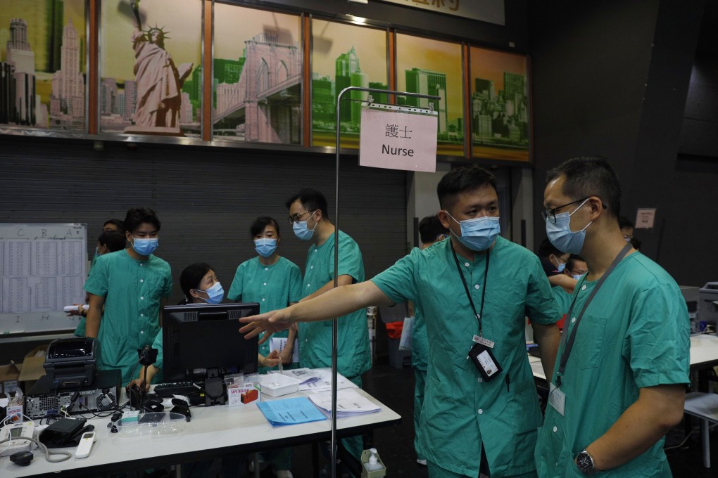 Medical workers make preparations at a temporary field hospital set up at AsiaWorld-Expo on August 1, as Hong Kong recorded more than a week of triple-digit highs in Covid-19 infections. Photo: AP