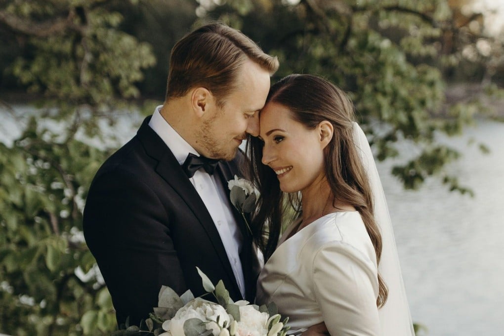 Finnish Prime Minister Sanna Marin and her new husband, Markus Raikkonen, pose for a photo after their wedding. Photo: Minttu Saarni/Finnish Prime Minister's Office via AP