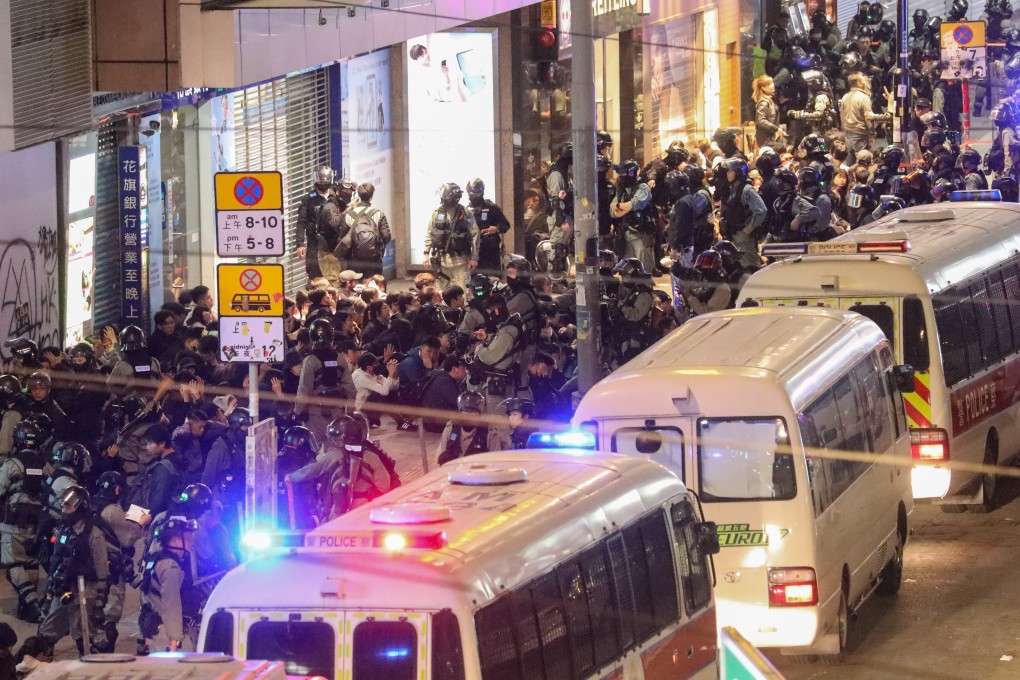 Police arrest anti-government protesters near the Sogo Department Store in Hong Kong’s Causeway Bay shopping district during a New Year's Day protest. Photo: Dickson Lee