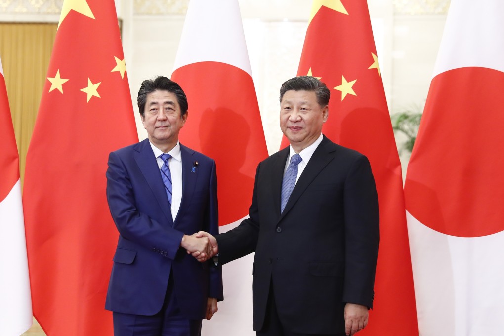 Japanese Prime Minister Shinzo Abe (left) was set to welcome Chinese President Xi Jinping (right) this year but the coronavirus pandemic has postponed the visit. Photo: DPA
