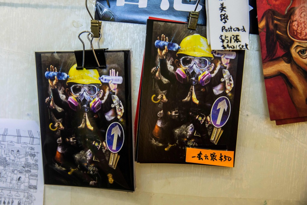 Postcards with artwork based on the pro-democracy protests at a bookstore in Hong Kong that stocks books with sensitive political titles that could potentially contravene the new Hong Kong national security law. Photo: AFP