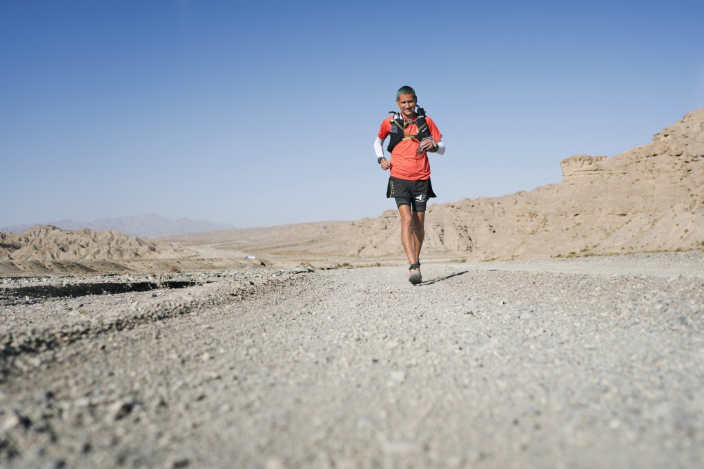 English ultramarathon runner Dan Lawson conquering the 2017 Ultra Gobi. Now Lawson refuses to fly for environmental reasons. Photo: Lloyd Belcher Visuals