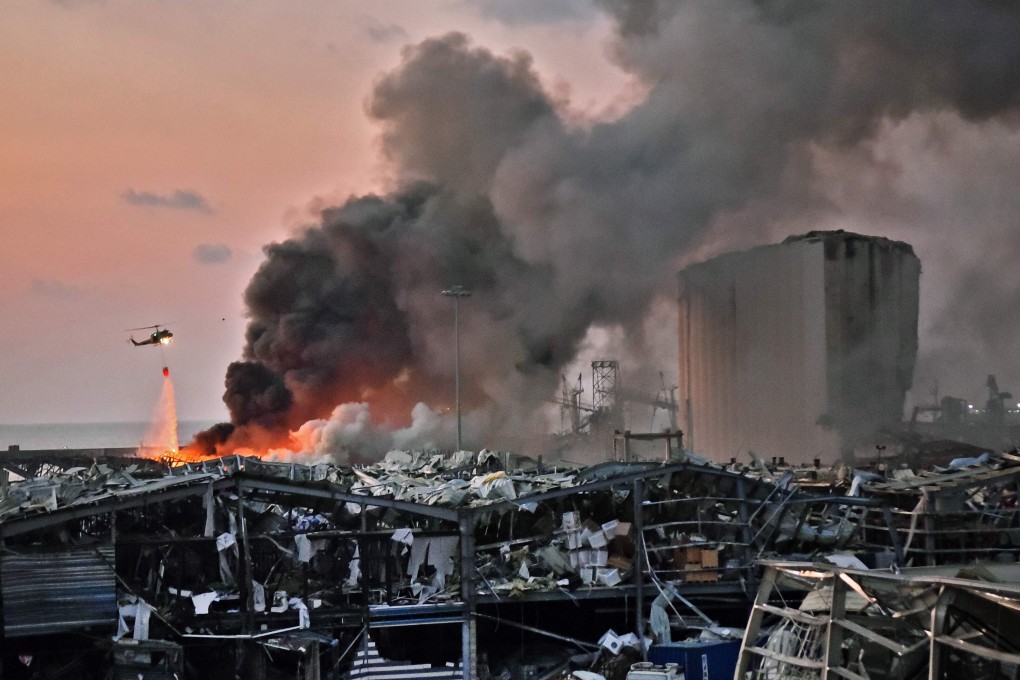 A helicopter puts out a fire at the scene of an explosion at the port of Lebanon’s capital Beirut. Photo: AFP