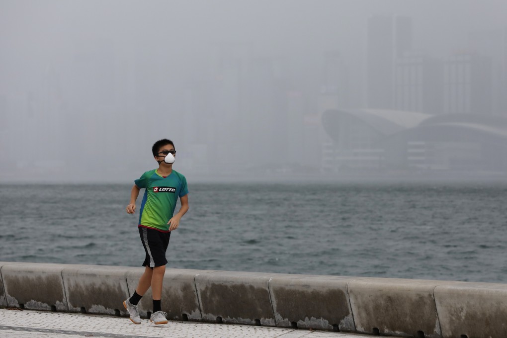 Hongkongers have to wear masks at all times, even when exercising, making for a very uncomfortable experience in the heat and humidity. Photo: May Tse