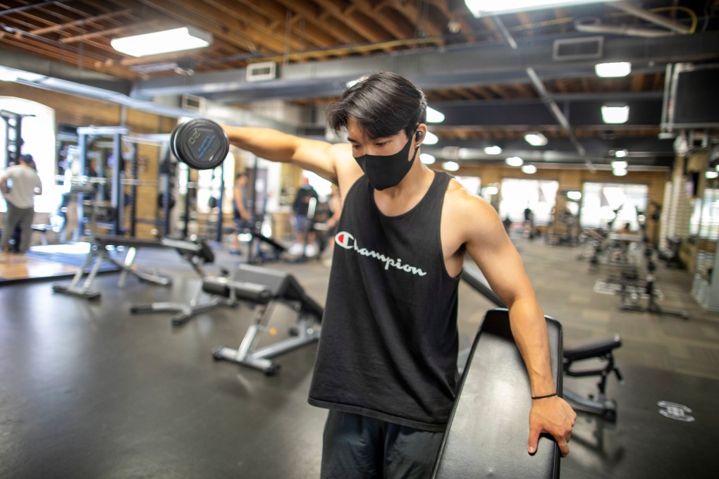 Alex Shin works out at Hone Fitness in Toronto, Ontario, after indoor dining restaurants, gyms and cinemas reopened on July 31. Photo: Reuters