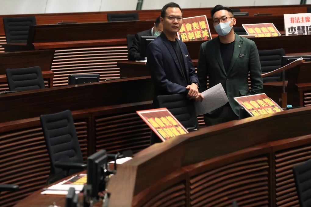 Pan-democrat lawmakers Dennis Kwok (left) and Alvin Yeung have been barred from running in the next Legislative Council polls and may not even be able to retain their seats in a caretaker version of Legco. Photo: May Tse