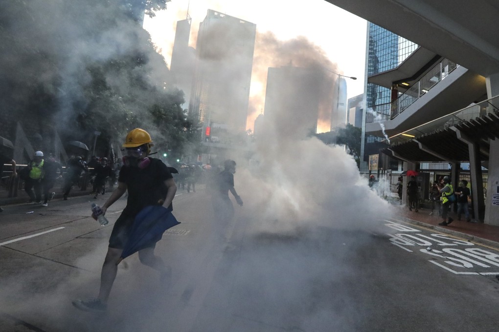 Riot police fire tear gas at protesters at a rally on Hong Kong Island on September 15 last year. Photo: Felix Wong