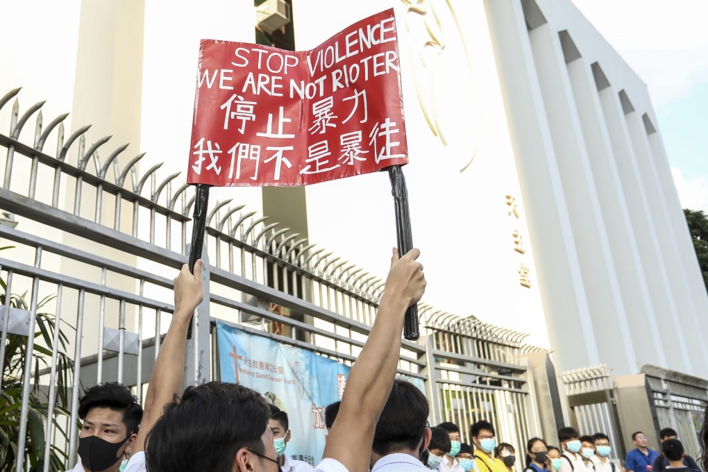 Students and alumni form a human chain outside Ng Wah Catholic Secondary School, in San Po Kong in September last year. Photo: Tory Ho