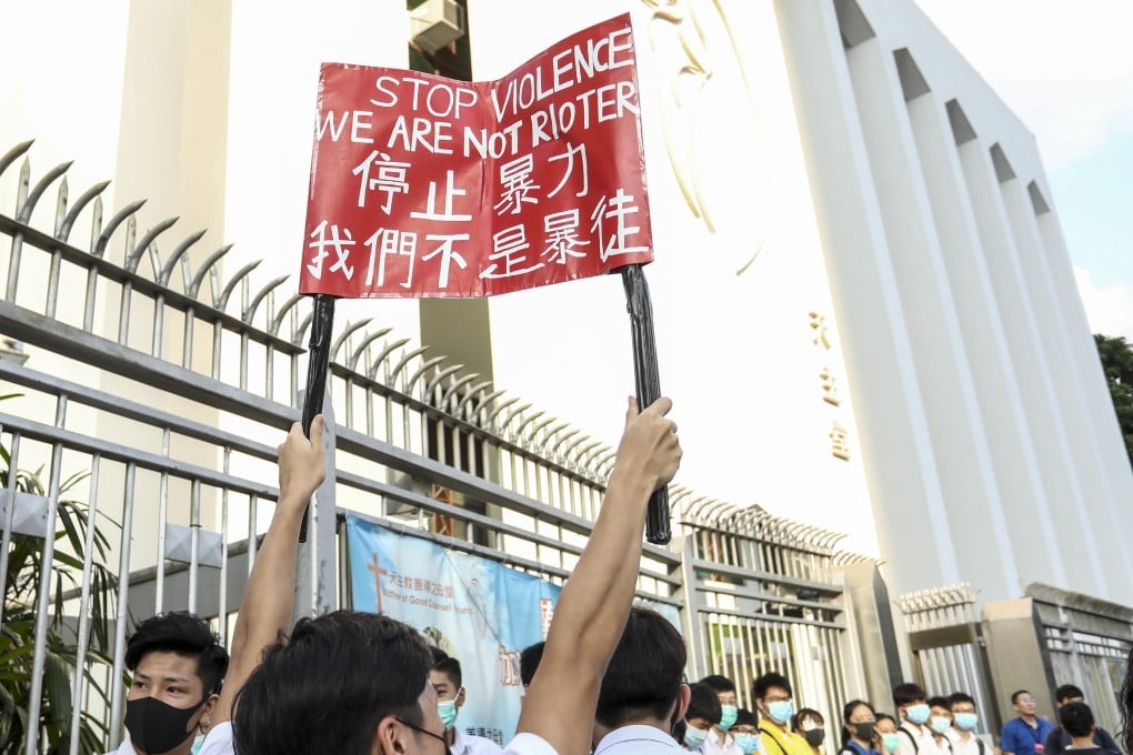Students and alumni form a human chain outside Ng Wah Catholic Secondary School, in San Po Kong in September last year. Photo: Tory Ho