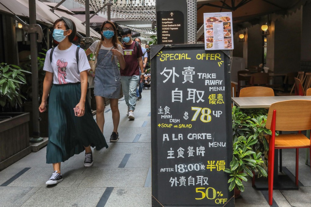 People walk past a restaurant in Causeway Bay on Monday. Photo: Nora Tam