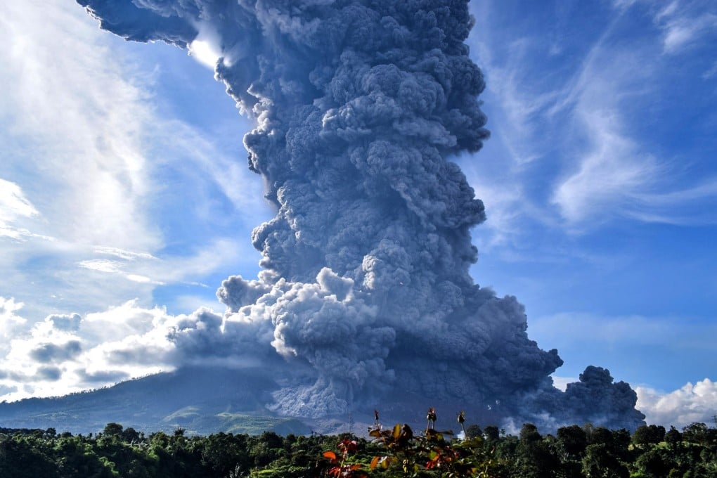 Mount Sinabung seen spewing volcanic smoke from Tiga Pancur Village in Karo, North Sumatra. Photo: EPA