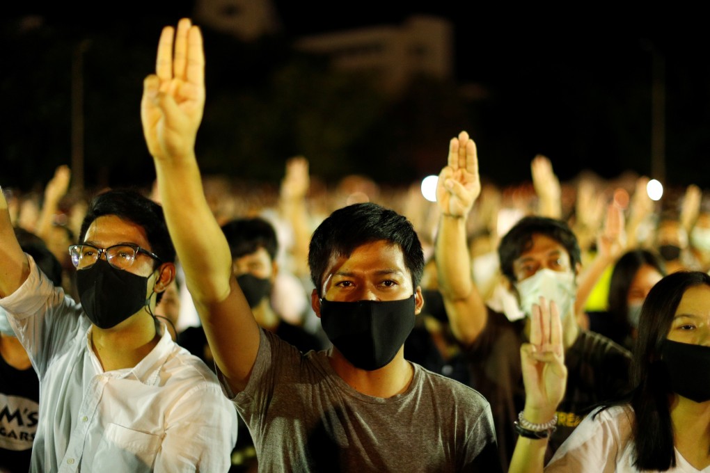 Thai pro-democracy protesters do a three-fingered salute at a rally on August 10 to demand that the government resign, parliament is dissolved, and new elections are held under a revised constitution. Photo: Reuters