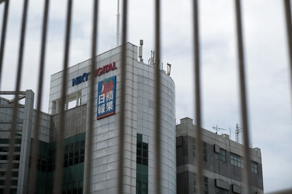 The Next Digital Ltd. offices, which house the newsroom of the Apple Daily newspaper, are seen behind a fence in Hong Kong on Monday. Photo: Bloomberg