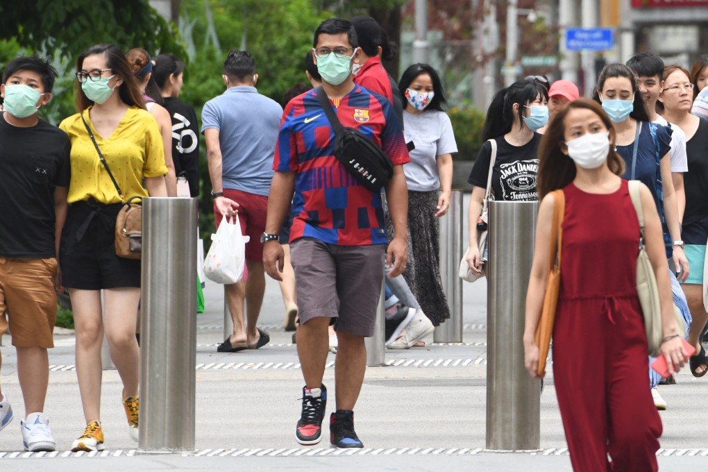 People seen in face masks at Orchard Road in Singapore. File photo: AFP