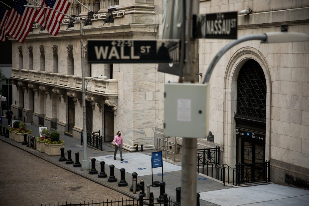 A person wearing a protective face mask enters the New York Stock Exchange (NYSE) in New York on Wednesday, June 17, 2020. Photo: Bloomberg