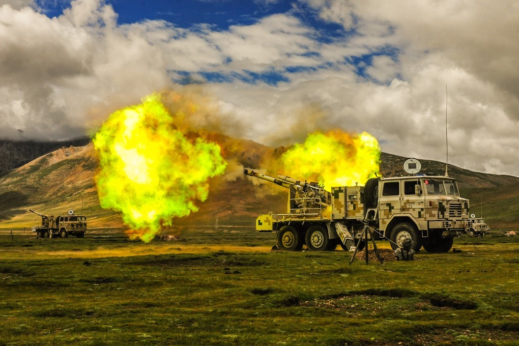 Flames shoot from a vehicle-mounted howitzer as it fires during an exercise in the Himalayas late last month. Photo: Handout
