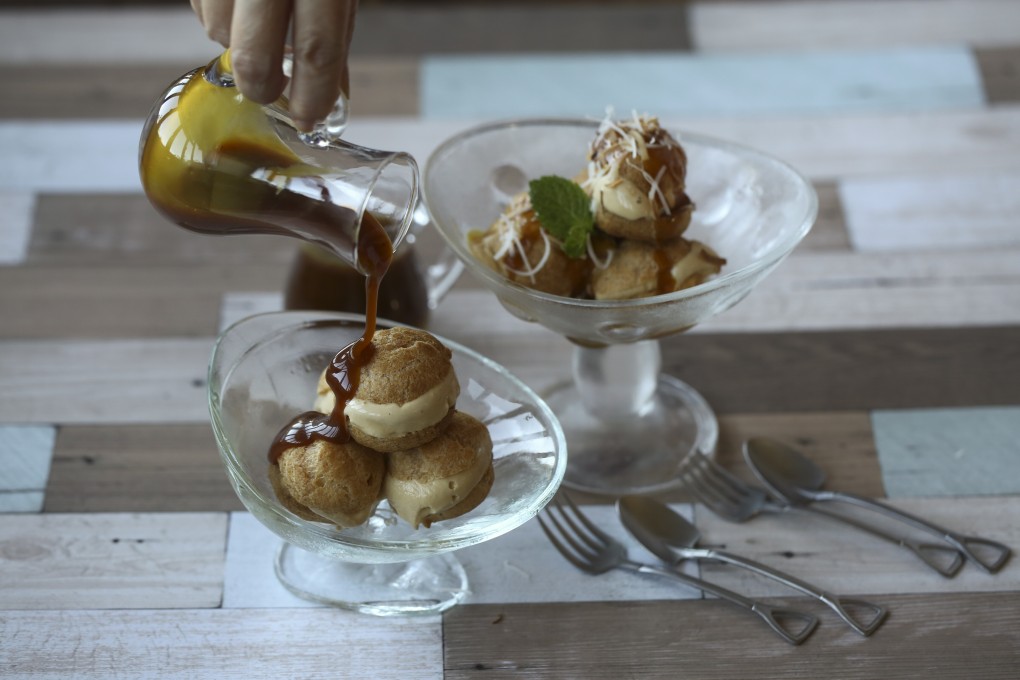 Susan Jung’s coconut-pandan ice cream profiteroles with gula melaka caramel. Photography: SCMP / Jonathan Wong. Styling: Nellie Ming Lee. Kitchen: courtesy of Culinart