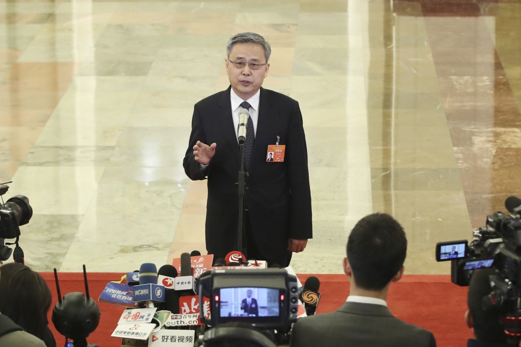 Guo Shuqing, chairman of the China Banking and Insurance Regulatory Commission, said that an increase in bad loans puts huge pressure on the nation’s lenders, especially small and regional ones. Photo: Xinhua