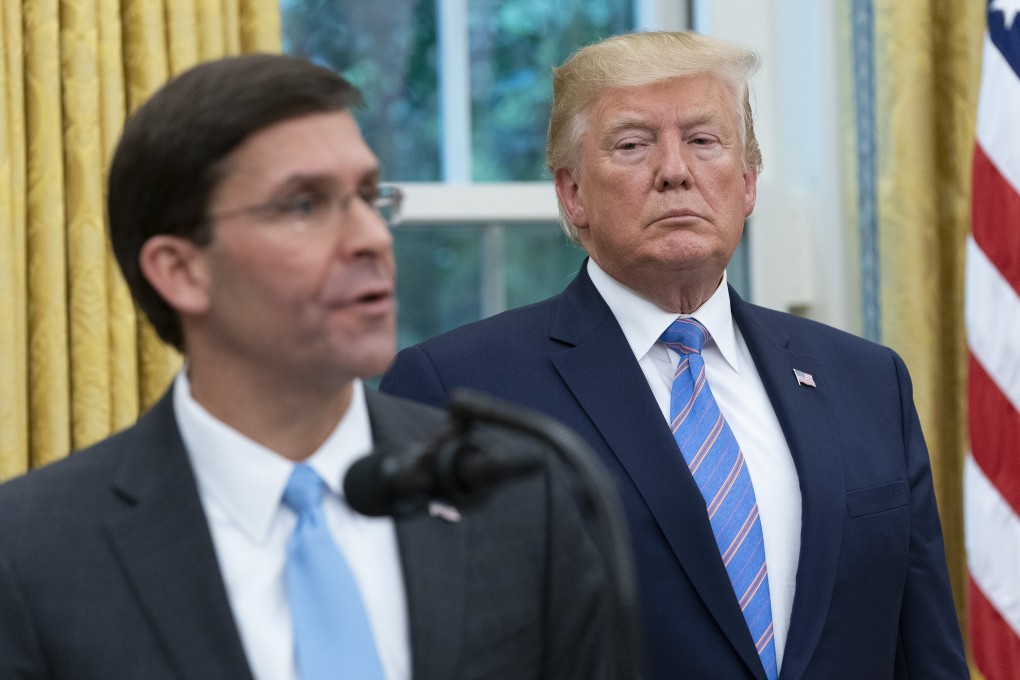 US President Donald Trump listens as Secretary of Defence Mark Esper speaks during his swearing-in ceremony in the Oval Office in July 2019. Photo: Bloomberg