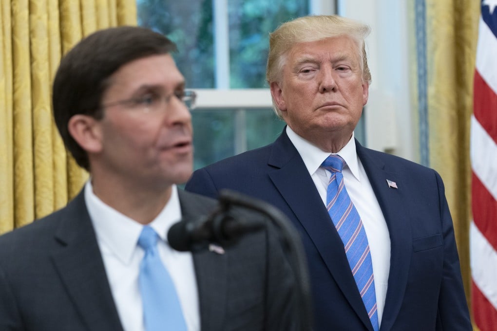 US President Donald Trump listens as Secretary of Defence Mark Esper speaks during his swearing-in ceremony in the Oval Office in July 2019. Photo: Bloomberg