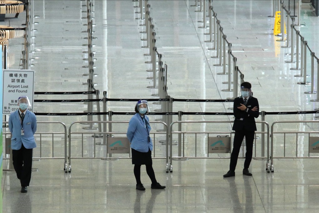 Staff at a deserted Hong Kong International Airport amid the coronavirus pandemic. Photo: Nora Tam