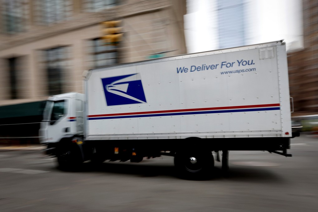 A US Postal Service mail truck drives through midtown Manhattan in New York on Thursday. Photo: Reuters