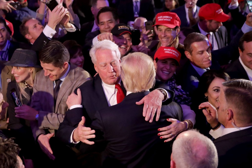 Donald Trump (front) hugs his brother Robert Trump after delivering his acceptance speech in New York after winning the US presidential election in November 2016. Photo: AFP