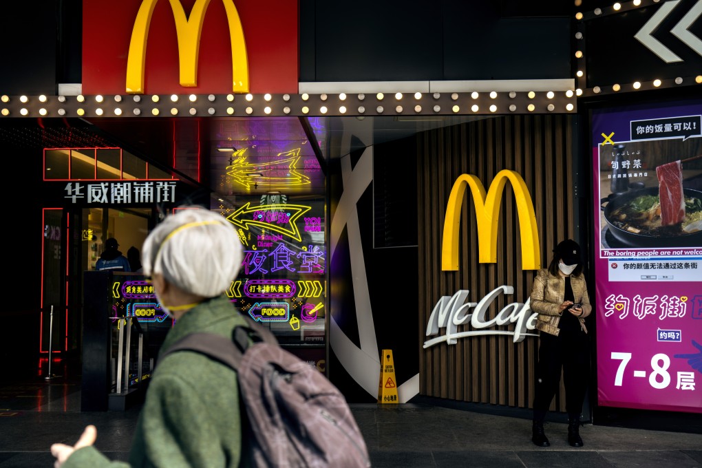 A pedestrian passes by a McDonald’s restaurant in Beijing, China. Photo: Bloomberg
