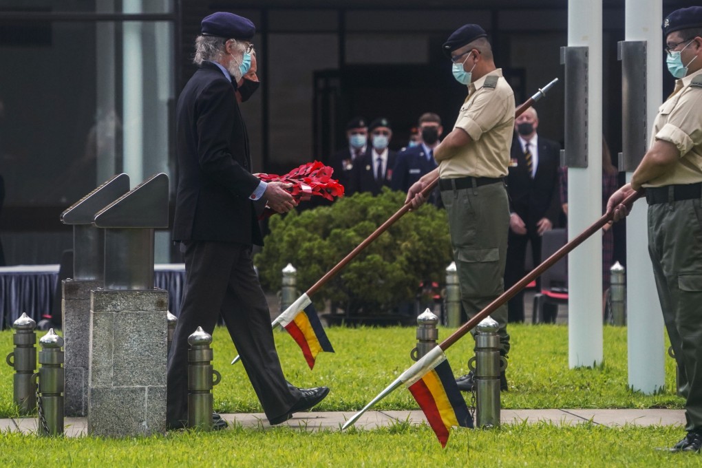 A participant lays a wreath at a ceremony on Sunday at the City Hall Memorial Garden in Central to mark the 75th anniversary of Hong Kong’s liberation from Japanese occupation in World War II. Photo: Felix Wong