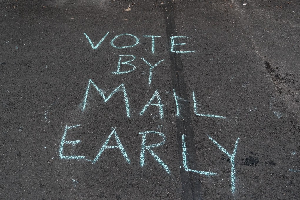 Demonstrators gather outside the condo of President Donald Trump donor and current US Postmaster General Louis Dejoy. Photo: AFP
