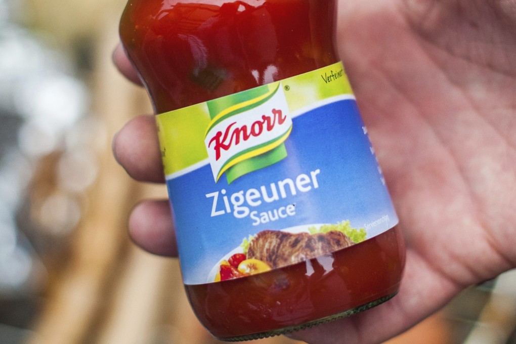 A man holds a bottle of ‘gypsy sauce’ from the manufacturer Knorr in this 2014 file photo. Photo: DPA via AP