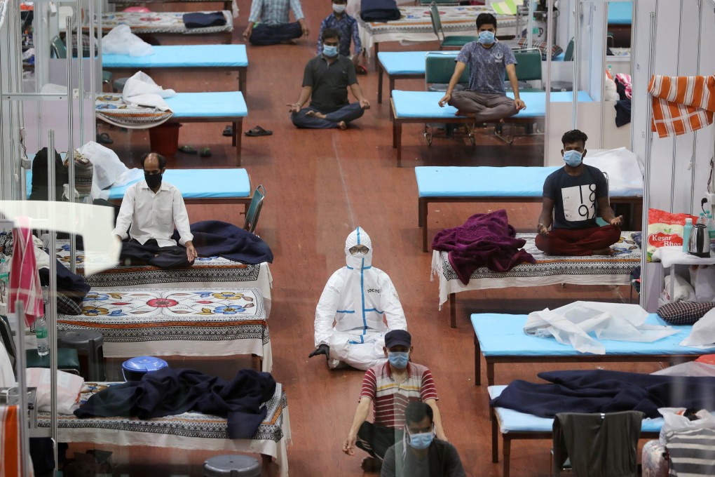 A yoga session at the men’s ward in the Covid-19 Care Centre set up at the Commonwealth Games Village Sports Complex in New Delhi, India, on July 30. India’s needs major reforms, and quickly, for its health care system to cope with Covid-19. Photo: Bloomberg