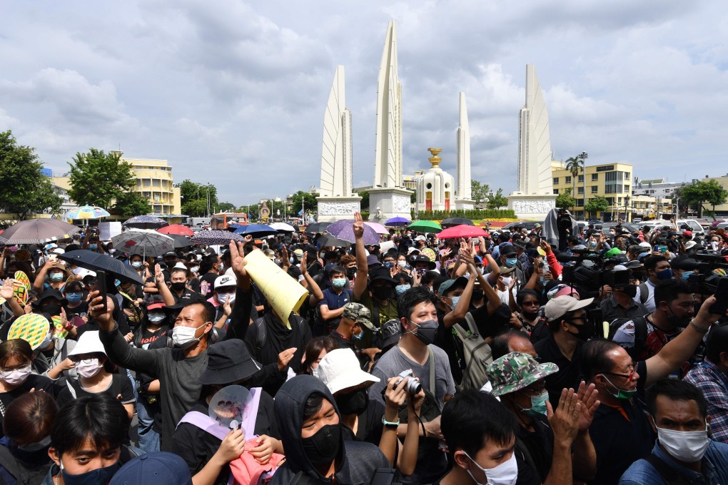 Anti-government protesters take part in a rally by the Democracy Monument in Bangkok on Sunday. Photo: AFP