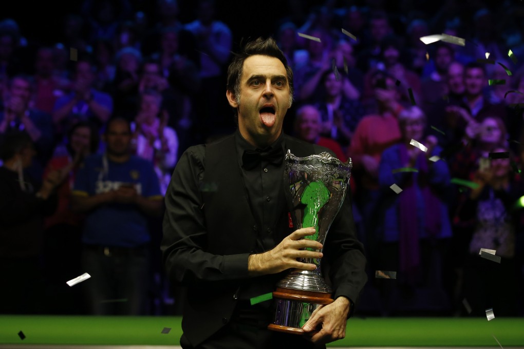 Ronnie O’Sullivan celebrates after winning the UK Snooker Championship final against Shaun Murphy. Photo: Xinhua