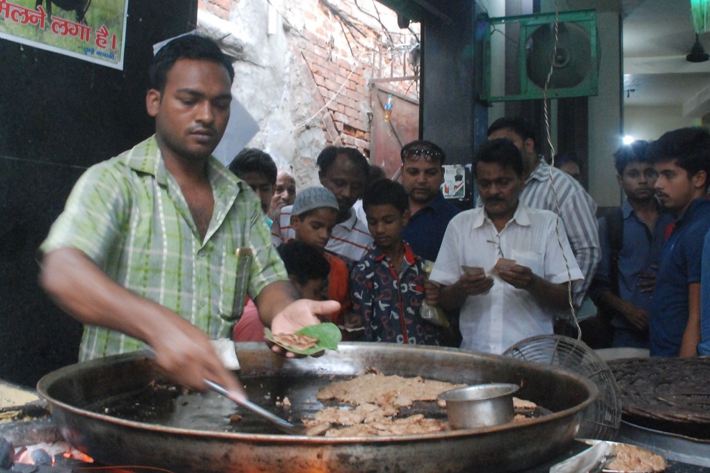 Kebabs being cooked at the Tunday Kababi restaurant in Lucknow, India, known for its version of the galouti kebab – so soft a king with no teeth could get fat on them. Photo: AFP