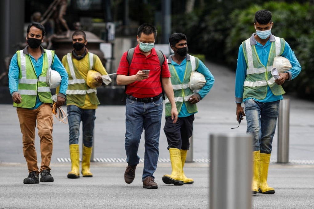Construction workers on Orchard Road, Singapore. Photo: Reuters