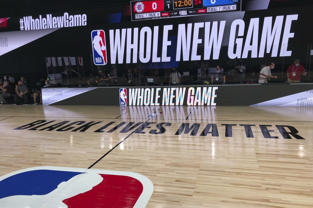 A basketball court at the ESPN Wide World of Sports complex showing the NBA’s marketing motto for the restart of the season: ‘Whole New Game’. Photo: AP