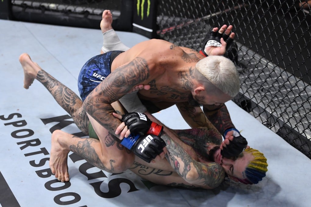Marlon Vera punches Sean O’Malley in their bantamweight bout during UFC 252. Photo: Jeff Bottari/Zuffa LLC
