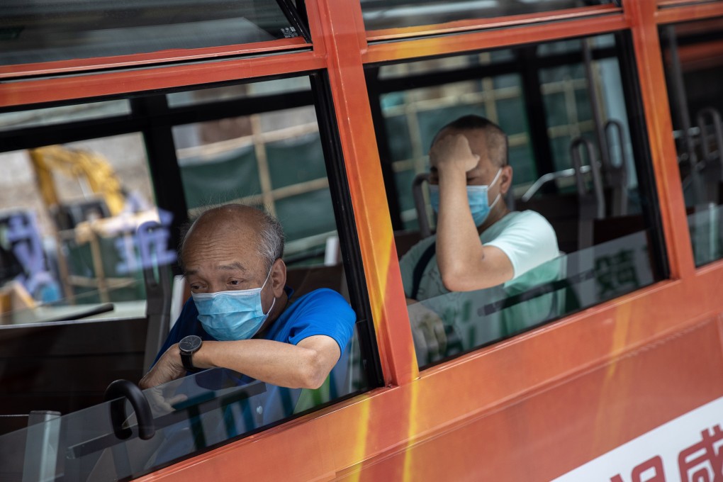 Tram passengers in protective face masks. Hong Kong is battling a third wave of Covid-19 infections. Photo: EPA-EFE