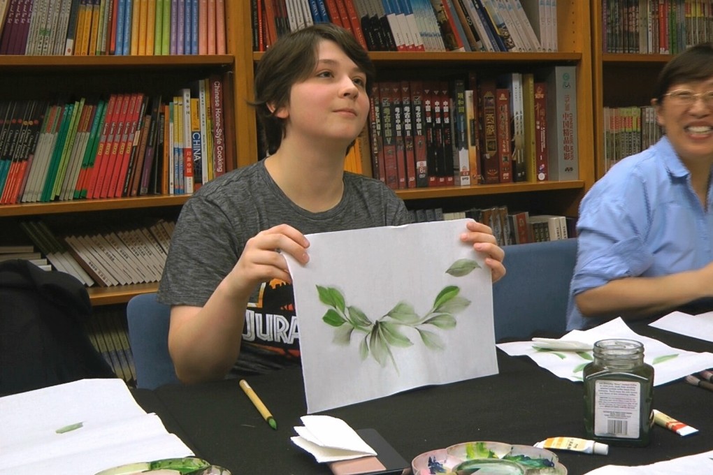A student takes a traditional Chinese painting class at the Confucius Institute at George Mason University in Fairfax, Virginia. Photo: AP